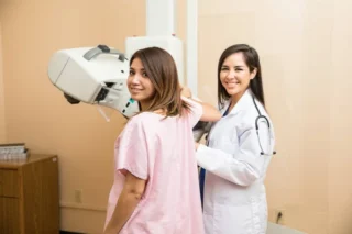 Doctor and patient during mammogram