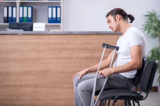 Young man at hospital reception